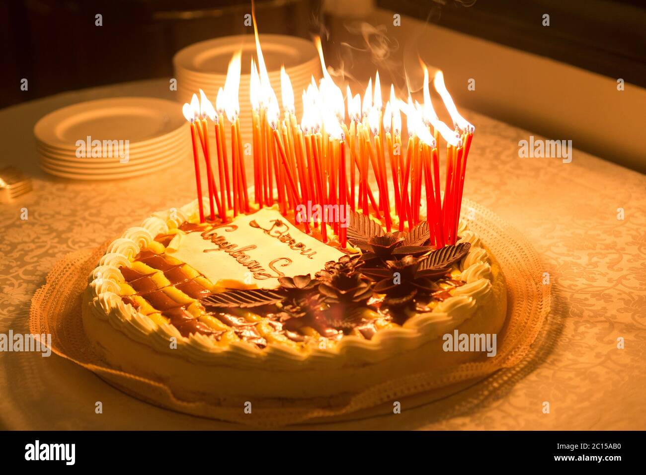 Detail of a birthday cake candles burning in a dark environment Stock ...