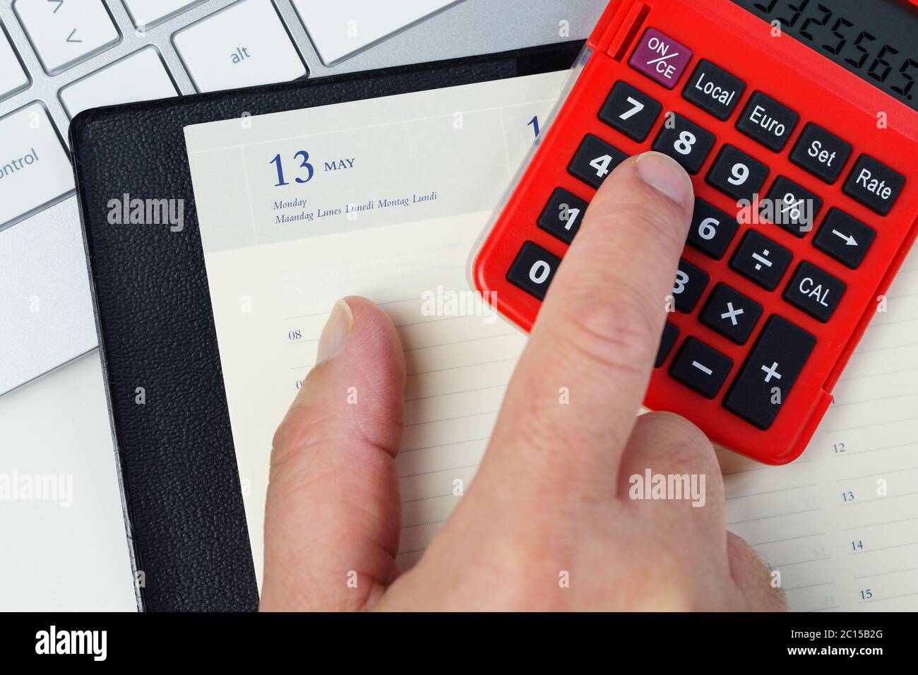 Accounting concept. Analyzing finance report with calculator Stock Photo