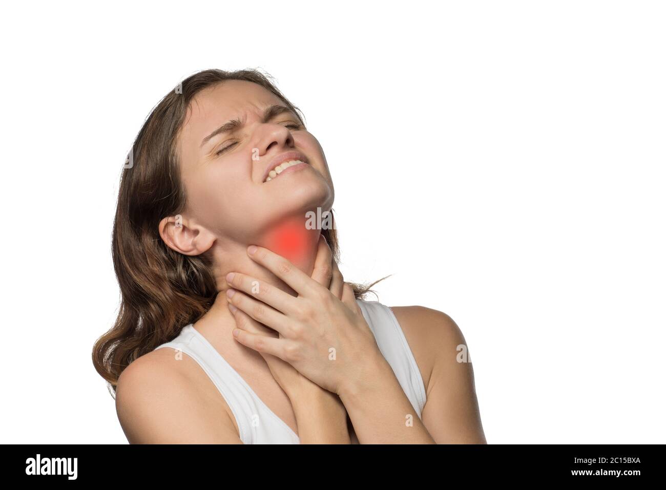 Beautiful woman holding her neck, because she hurts against a