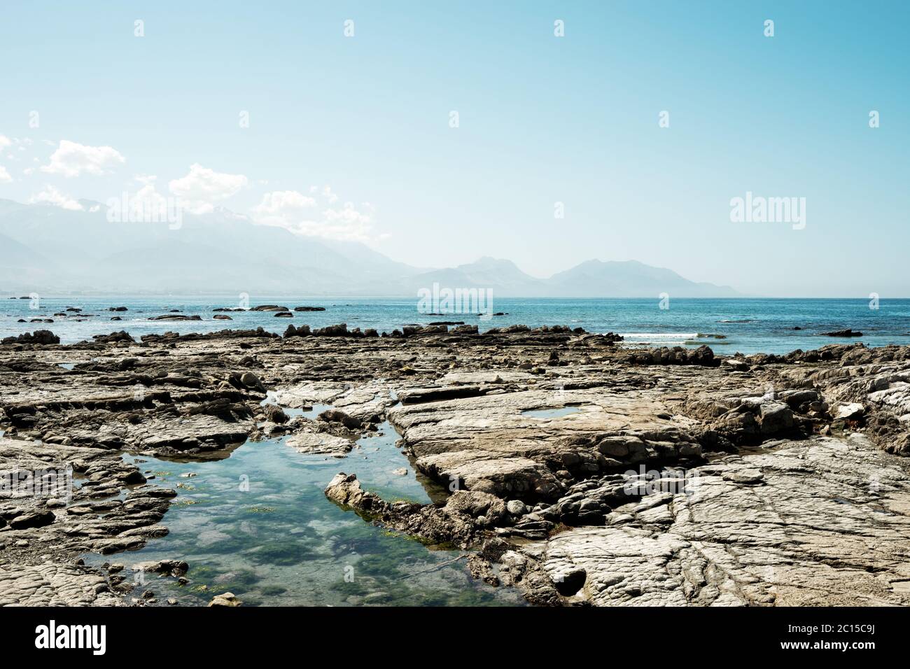 Rocky beach blue sky hi-res stock photography and images - Alamy