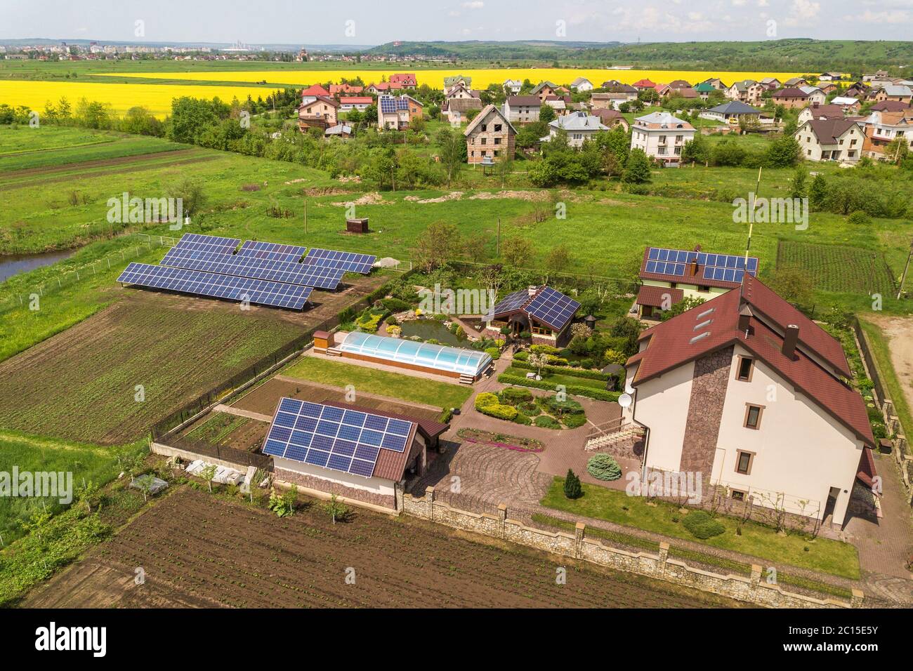 Picture of Aerial view of a private house in summer with blue solar photo voltaic ...
