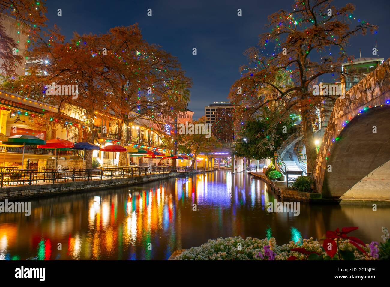 San Antonio River Walk and stone bridge over San Antonio River near Alamo in downtown San Antonio, Texas, USA. Stock Photo