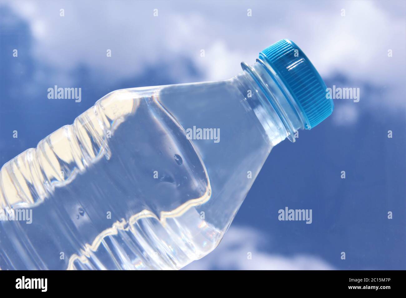 Fresh water bottle on blue sky background Stock Photo