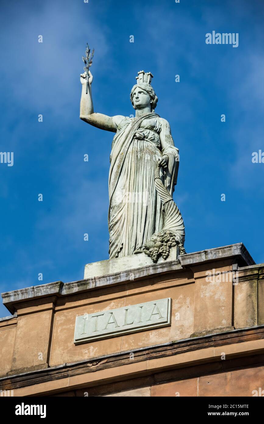 Italia rooftop Statue on the Italian Centre on Ingram Street / John Street, Glasgow, Scotland. Stock Photo
