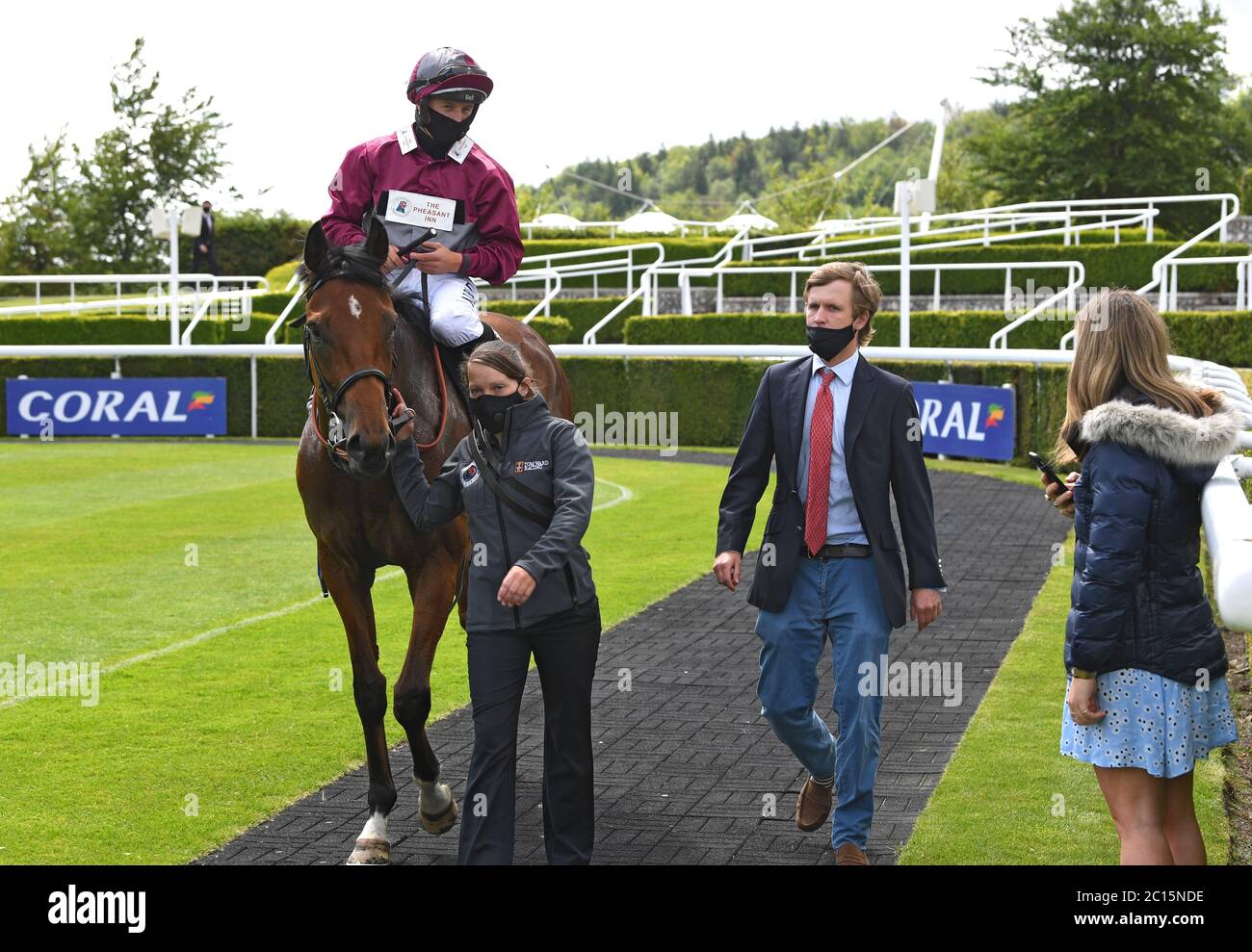 Tom Ward (right) walks back with his winner Mouriyani and Tom Marquand into  the winners enclosure at Goodwood Racecourse Stock Photo - Alamy