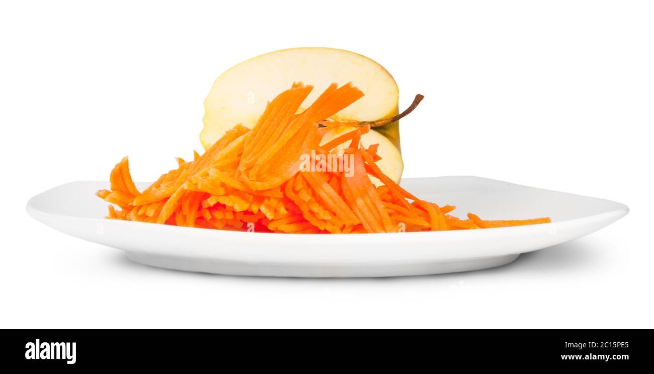 Half An Apple With Grated Carrot On White Plate Stock Photo