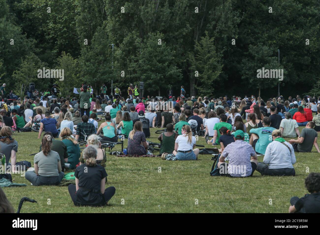 London UK 14 June 2020 Wandsworth Stand up to Racism and BLM , organised a peaceful protest on Tooting Common today. People who attended wore green as asked by the organisers to remember the 3rd anniversary of the fire at Greenfell, and a candle was lighted for those who died. Paul Quezada-Neiman/Alamy Live News Stock Photo