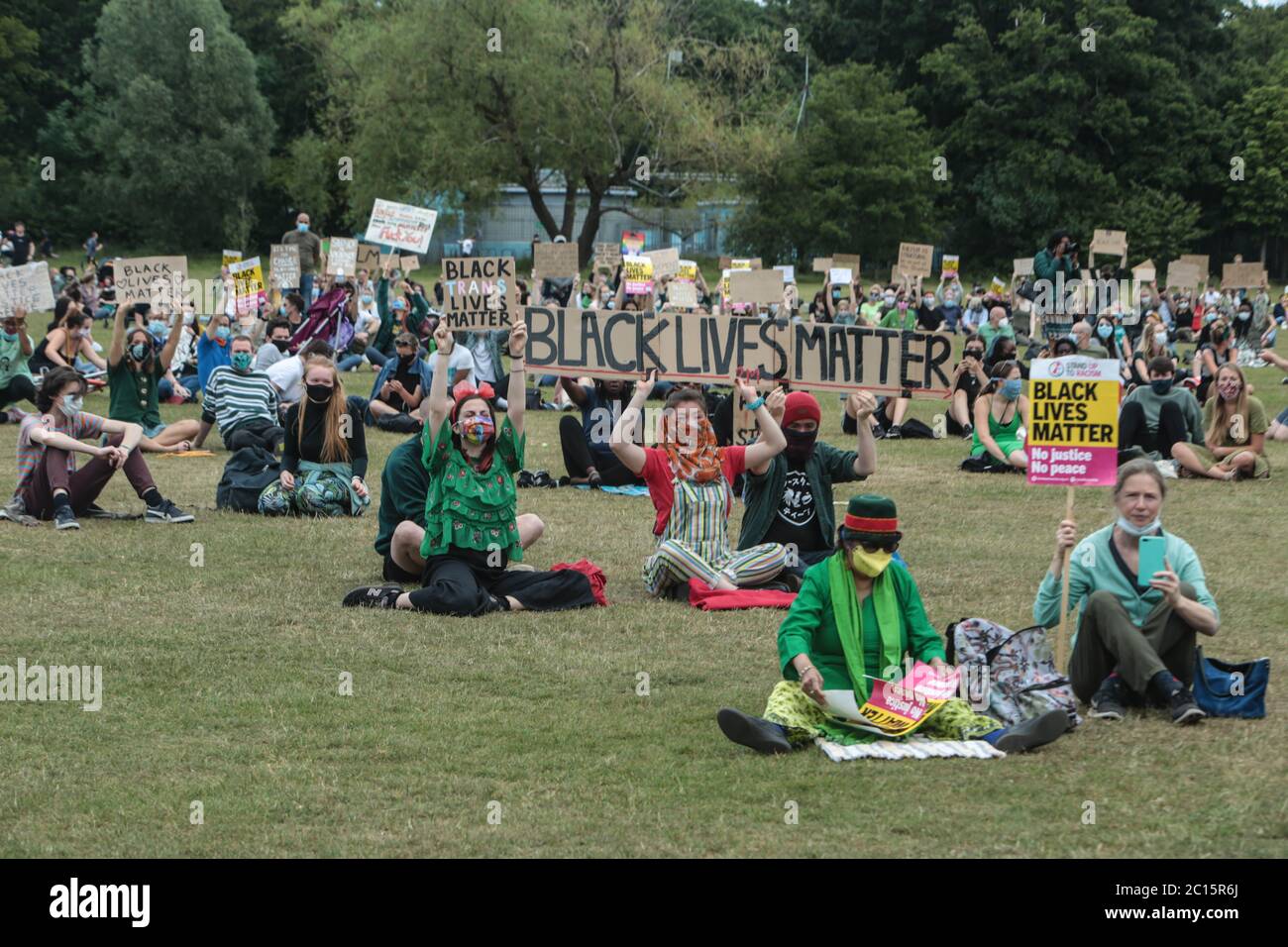 London UK 14 June 2020 Wandsworth Stand up to Racism and BLM , organised a peaceful protest on Tooting Common today. People who attended wore green as asked by the organisers to remember the 3rd anniversary of the fire at Greenfell. Paul Quezada-Neiman/Alamy Live News Stock Photo