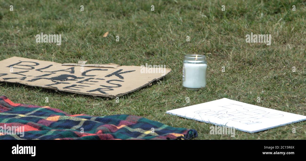 London UK 14 June 2020 Wandsworth Stand up to Racism and BLM , organised a peaceful protest on Tooting Common today. People who attended wore green as asked by the organisers to remember the 3rd anniversary of the fire at Greenfell, and a candle was lighted for those who died. Paul Quezada-Neiman/Alamy Live News Stock Photo