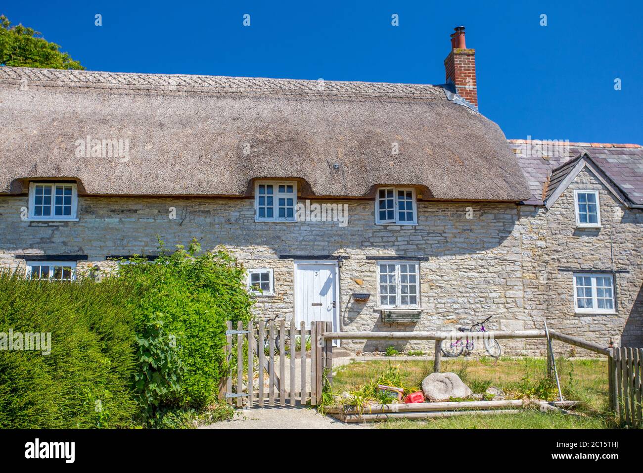 Quaint thatched cottage in Kimmeridge village, Dorset, England, UK Stock Photo