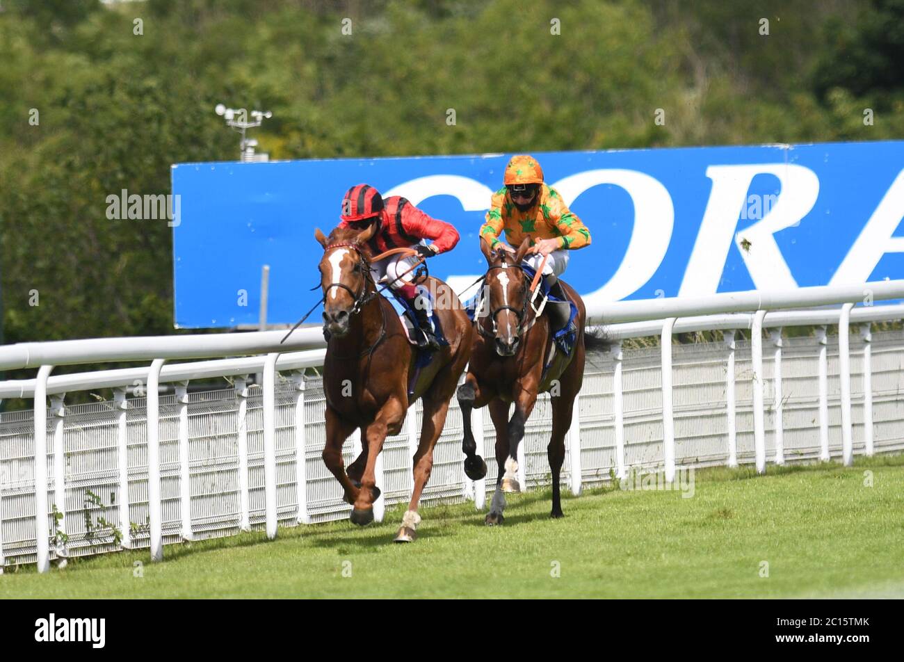 Bright Eyed Eagle ridden by Oisin Murphy (left) veers left causing Joe Fanning to snatch up on Glenties resulting in a steward's enquiry where the result stood at Goodwood Racecourse. Stock Photo