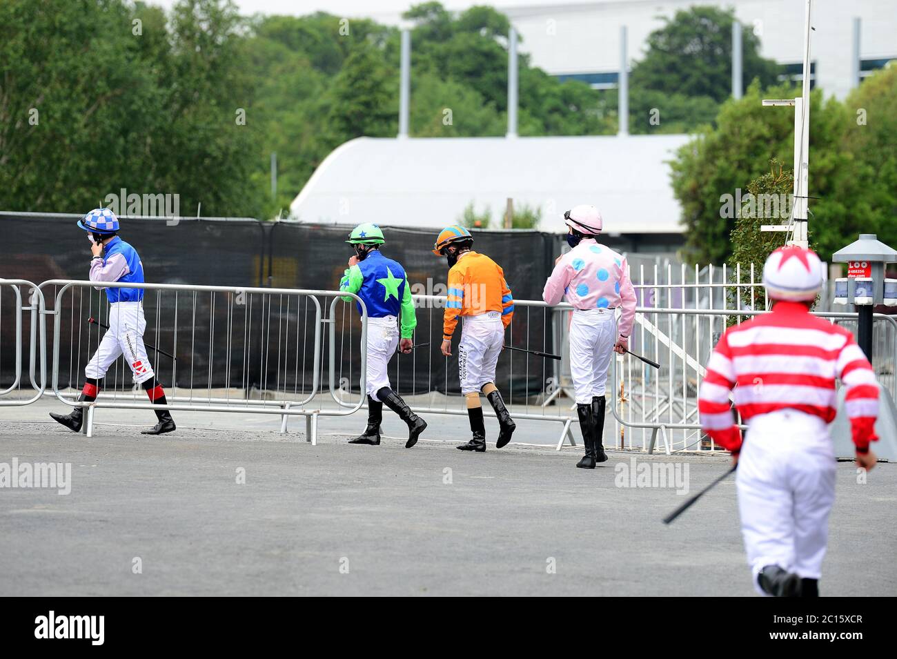 Jockeys head to the parade ring for the Holden Plant Rental Handicap at Leopardstown Racecourse. Stock Photo