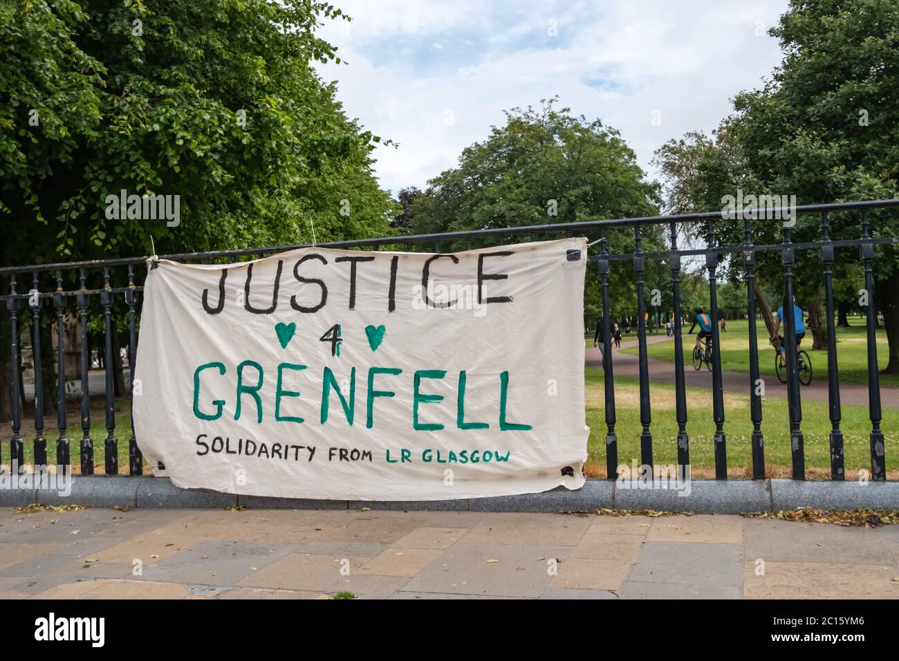 Glasgow, Scotland, UK. 14th June, 2020. A banner fixed to the railings of Glasgow Green saying Justice 4 Grenfell. The  Grenfell Tower fire took place three years ago on 14th June  2017 when 72 people died after the cladding of a tower block in London caught fire. Credit: Skully/Alamy Live News Stock Photo