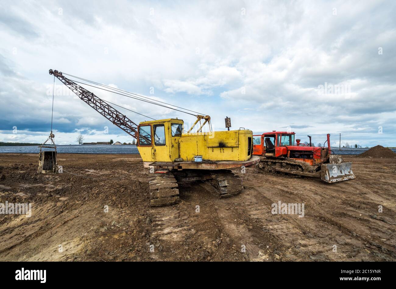 Excavator and tractor Stock Photo Alamy