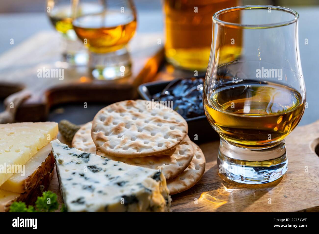 Whiskey and cheese pairing, tasting whisky glasses and plate with