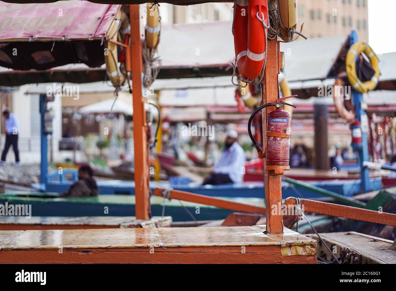 Dubai / United Arab Emirates - February 1, 2020: powder fire extinguisher in small ferry boats for transporting people along downtown Dubai canal Stock Photo