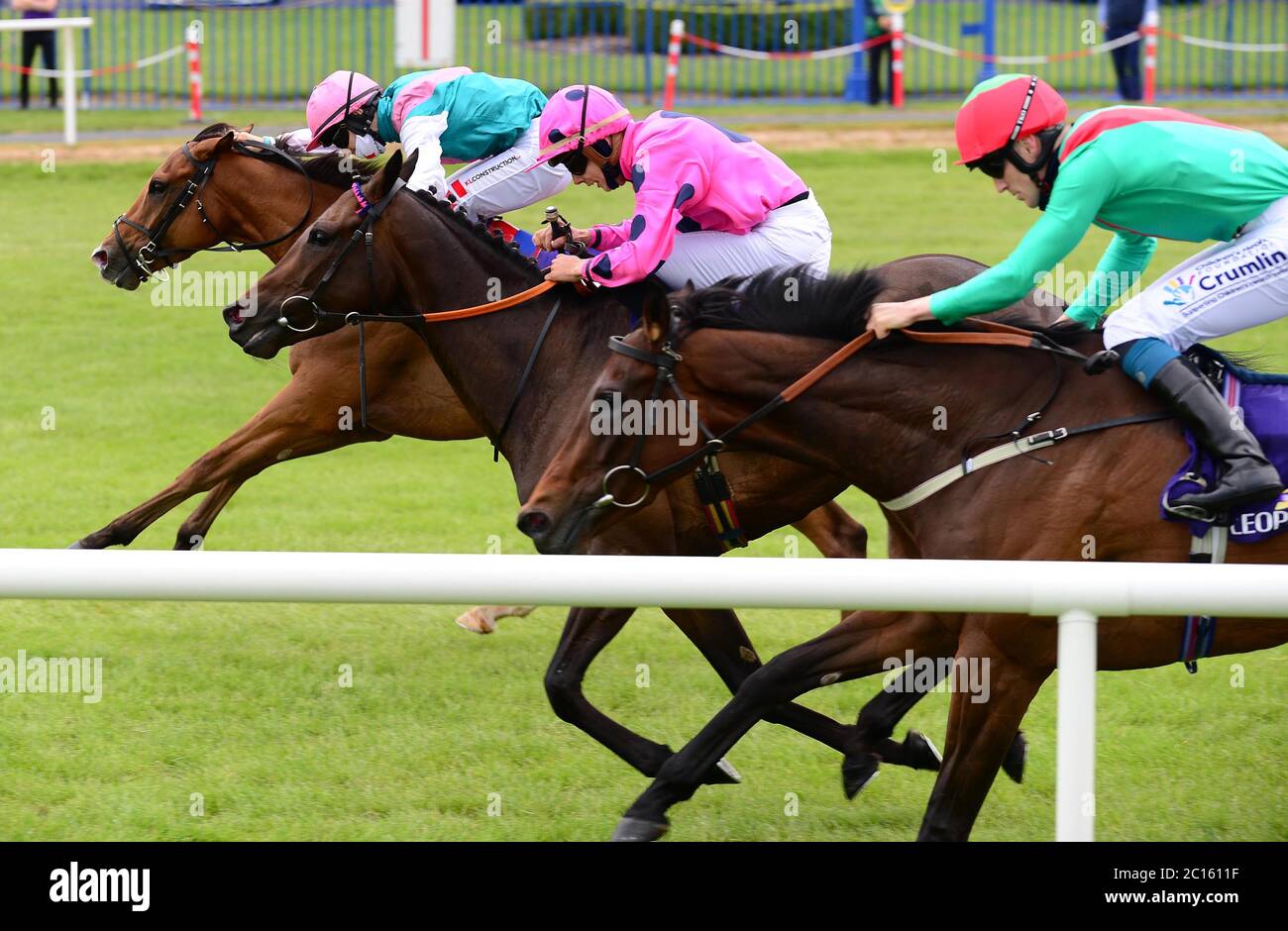 Heliac ridden by Colin Keane (left) beats Fresnel ridden by Ronan Whelan and Loveisthehigherlaw ridden by Billy Lee (right) to win the Irish Stallion Farms EBF Noblesse Stakes at Leopardstown Racecourse. Stock Photo