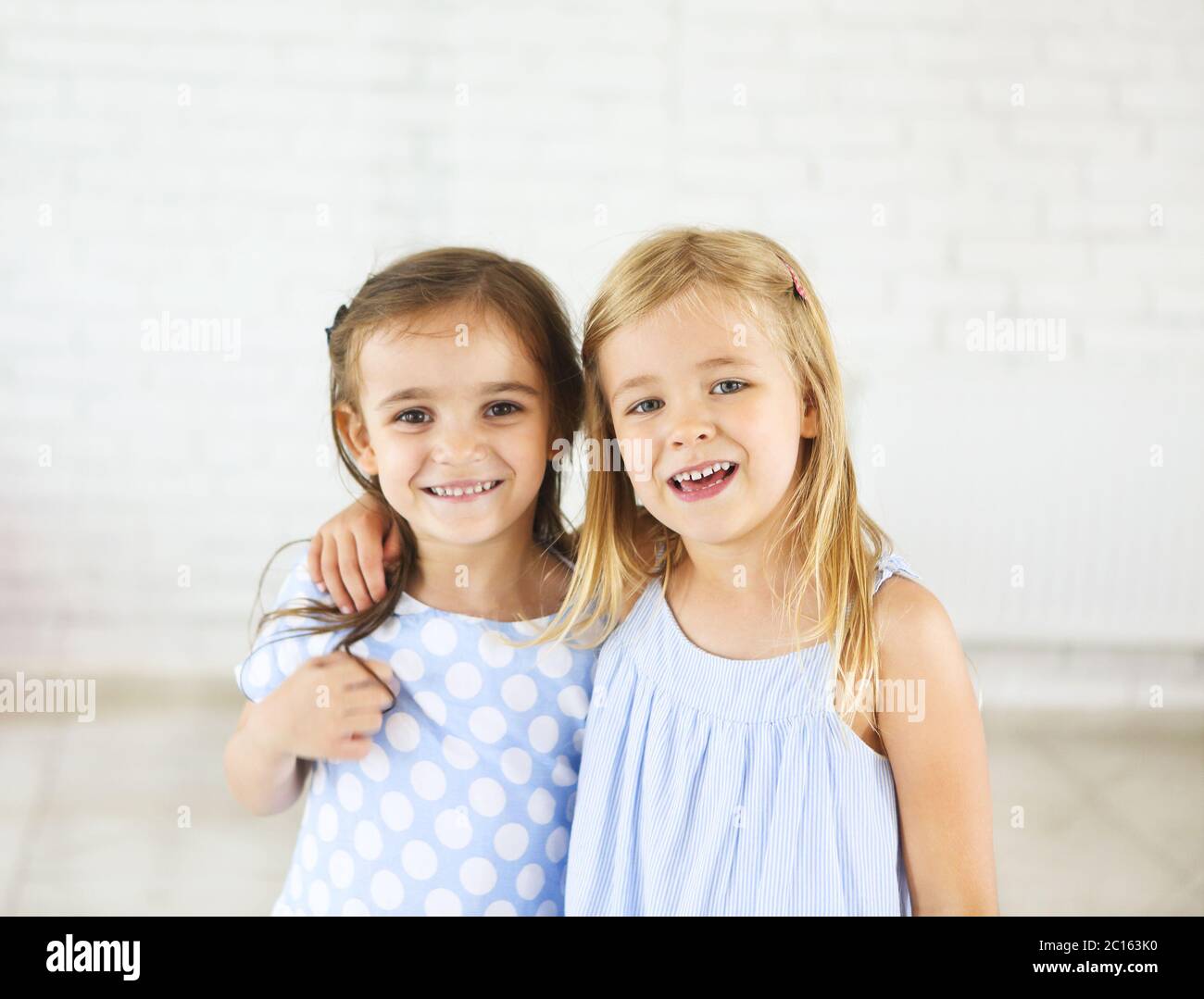 Portrait of two happy smiling young girls Stock Photo - Alamy