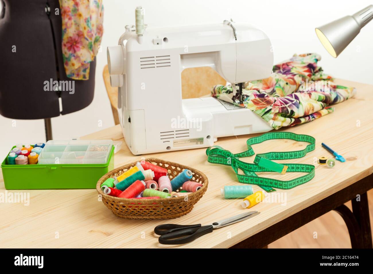 the sewing machine costs on a table Stock Photo