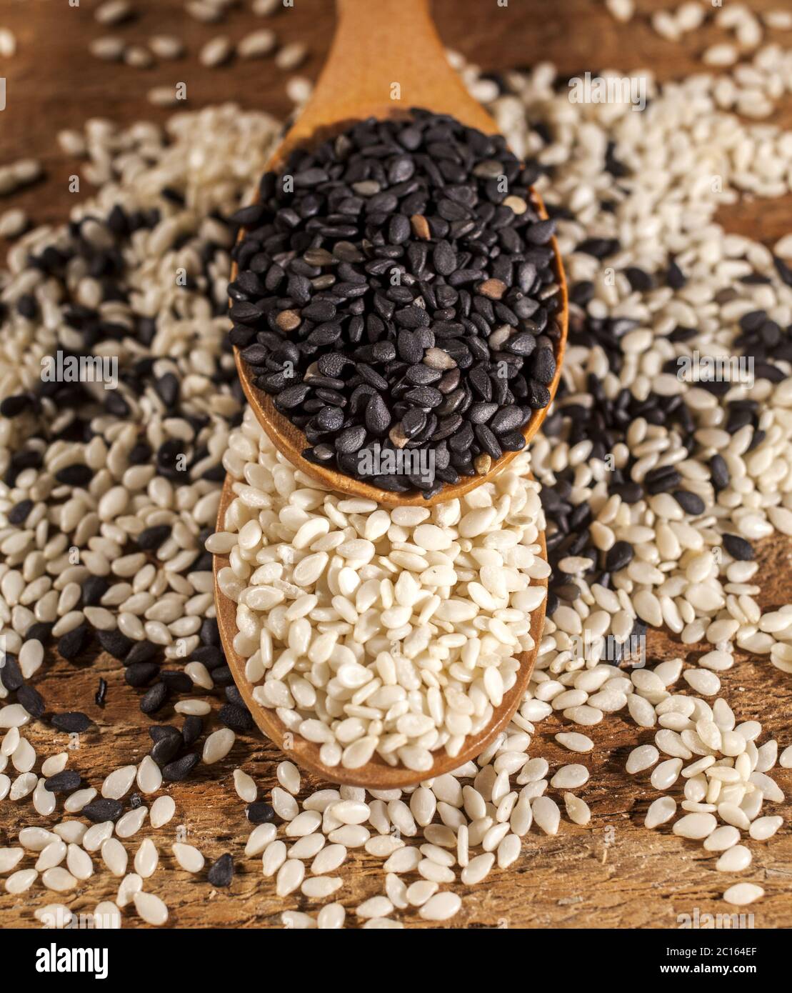 Fresh black and white sesame seeds in spoons Stock Photo - Alamy