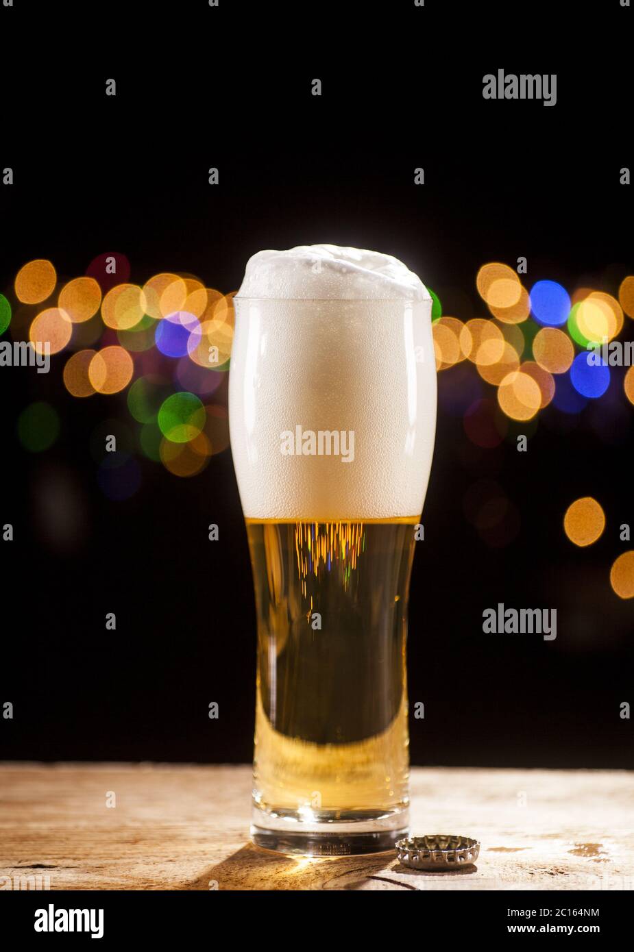 Glass of beer on bar lights background Stock Photo