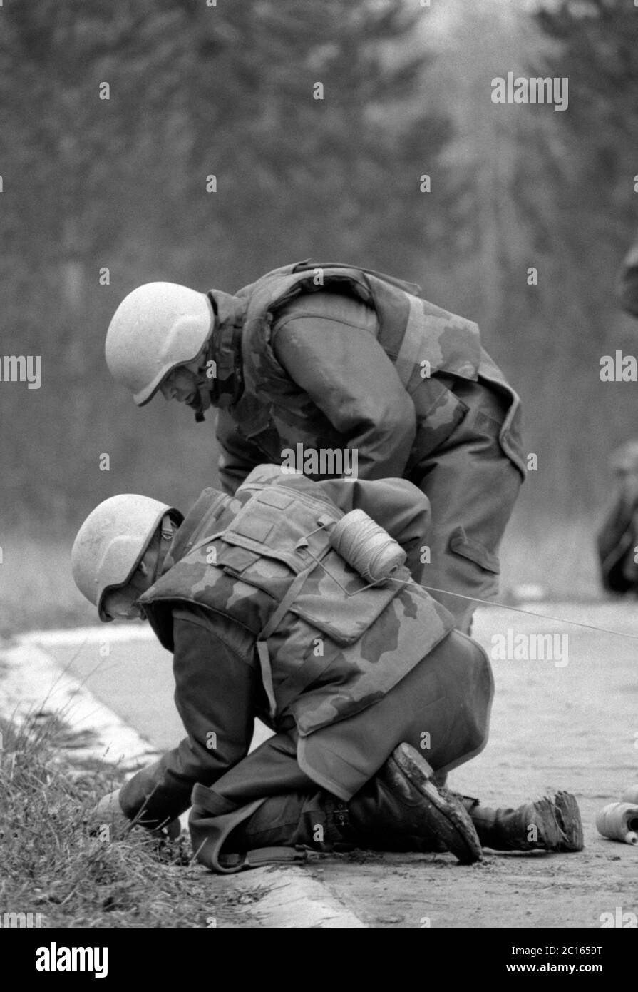 8th March 1994 During the war in Bosnia: French UNPROFOR soldiers clear mines at Tuzla Airport to allow aid flights to commence in a few days time. Stock Photo