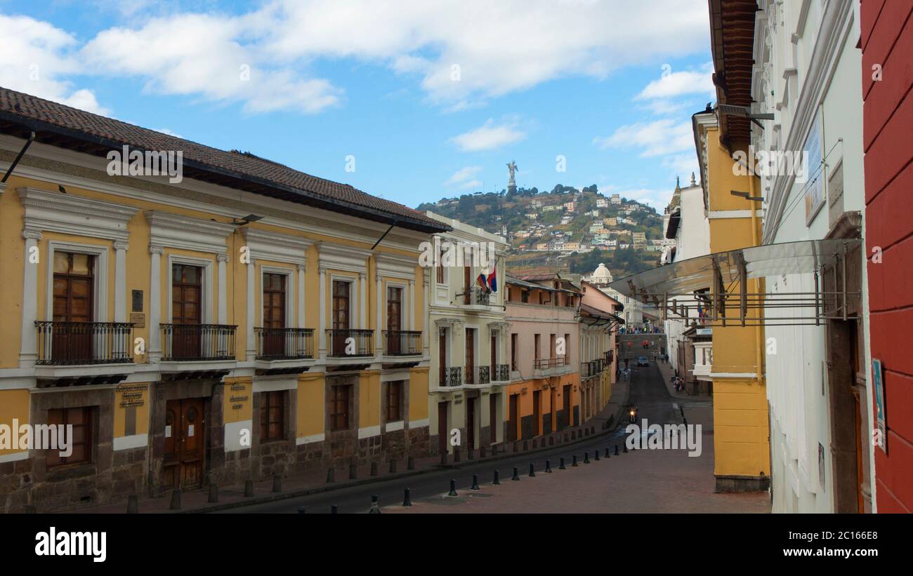 Quito, Pichincha / Ecuador - July 29 2018: People walking on Cuenca street with the virgin of El Panecillo in the background Stock Photo