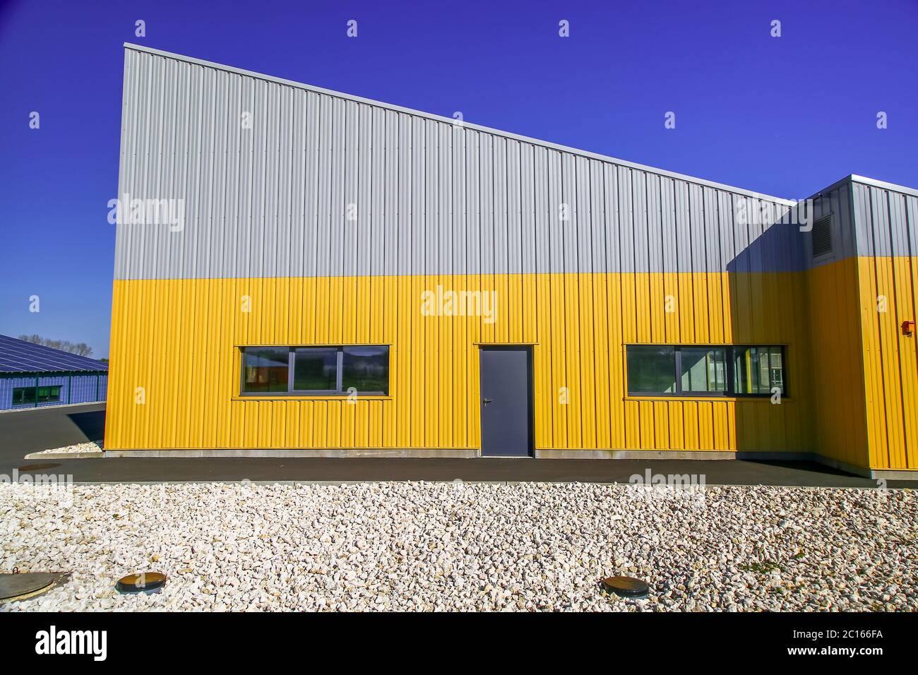 Surgeres, France - April 09, 2017:newly build modern red office building with warehouse Stock Photo