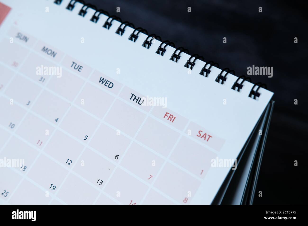 detail view of calendar on dark background Stock Photo - Alamy