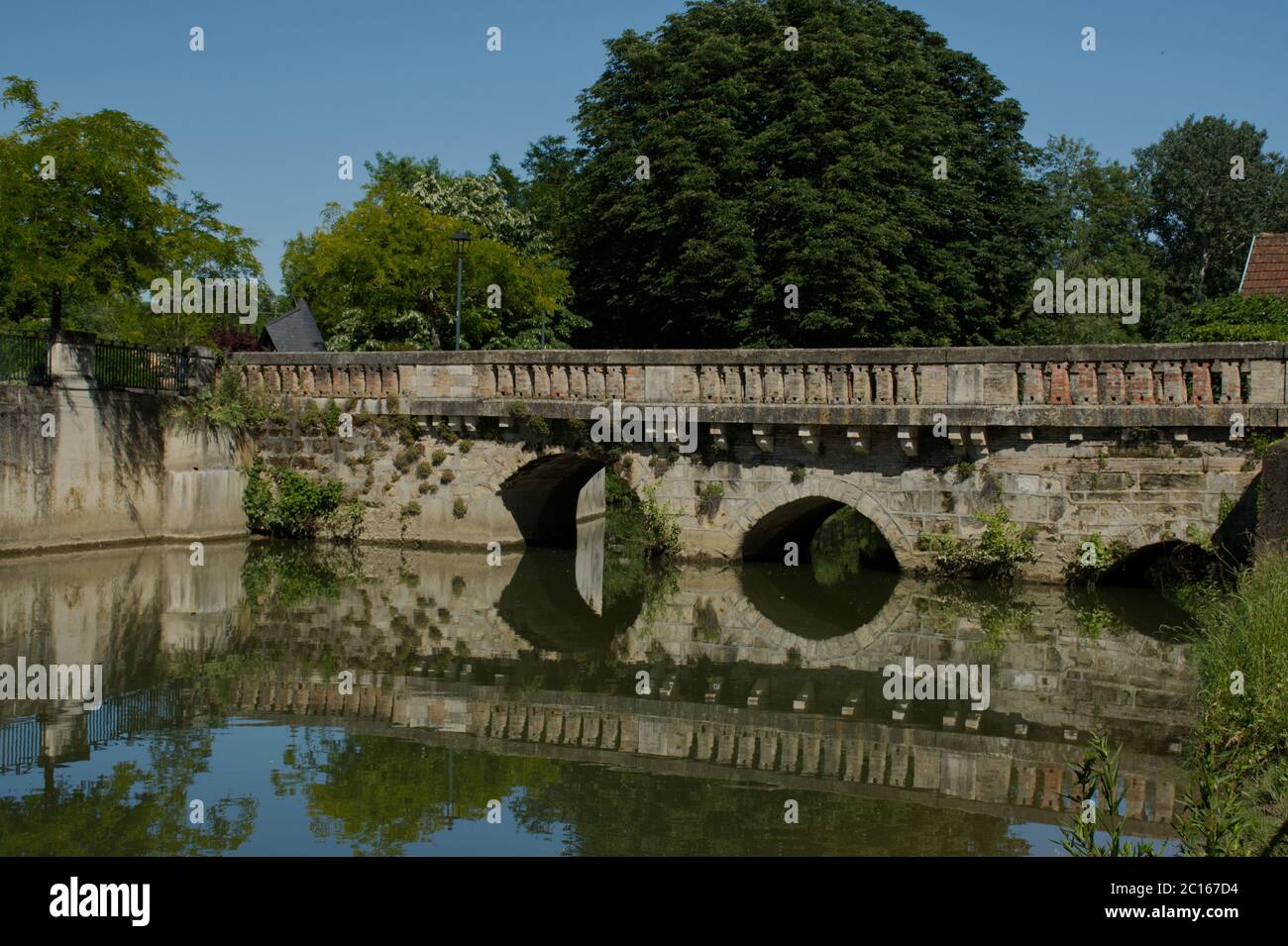 The old bridge at Allemans-du-Dropt, standing on the site of the original bridge built by the Romans. Stock Photo