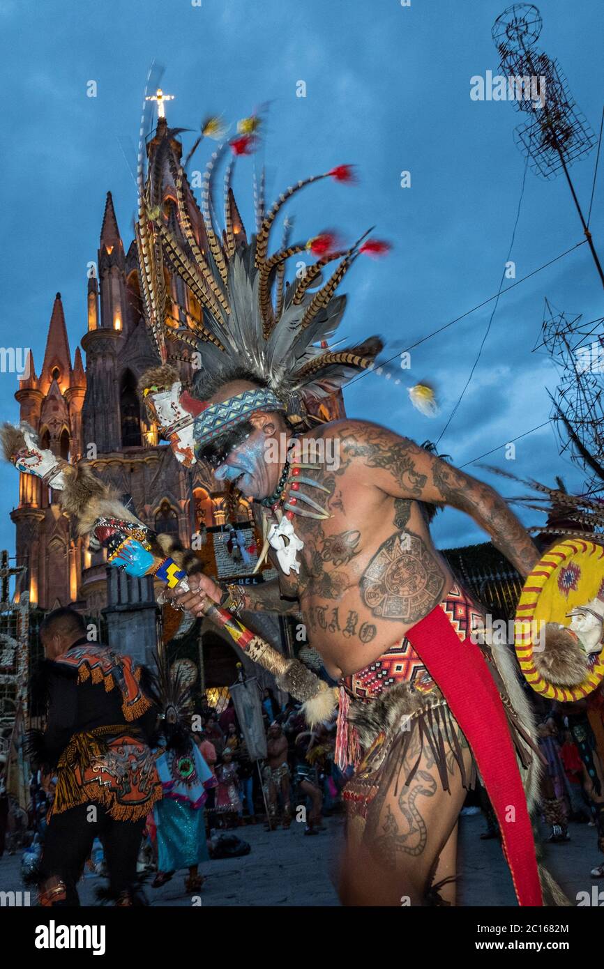 Mexican Concheros dance in a ceremony outside the Parroquia Church of Michael the Archangel during the week long fiesta of the patron saint Saint Michael October 1, 2017 in San Miguel de Allende, Mexico. Stock Photo