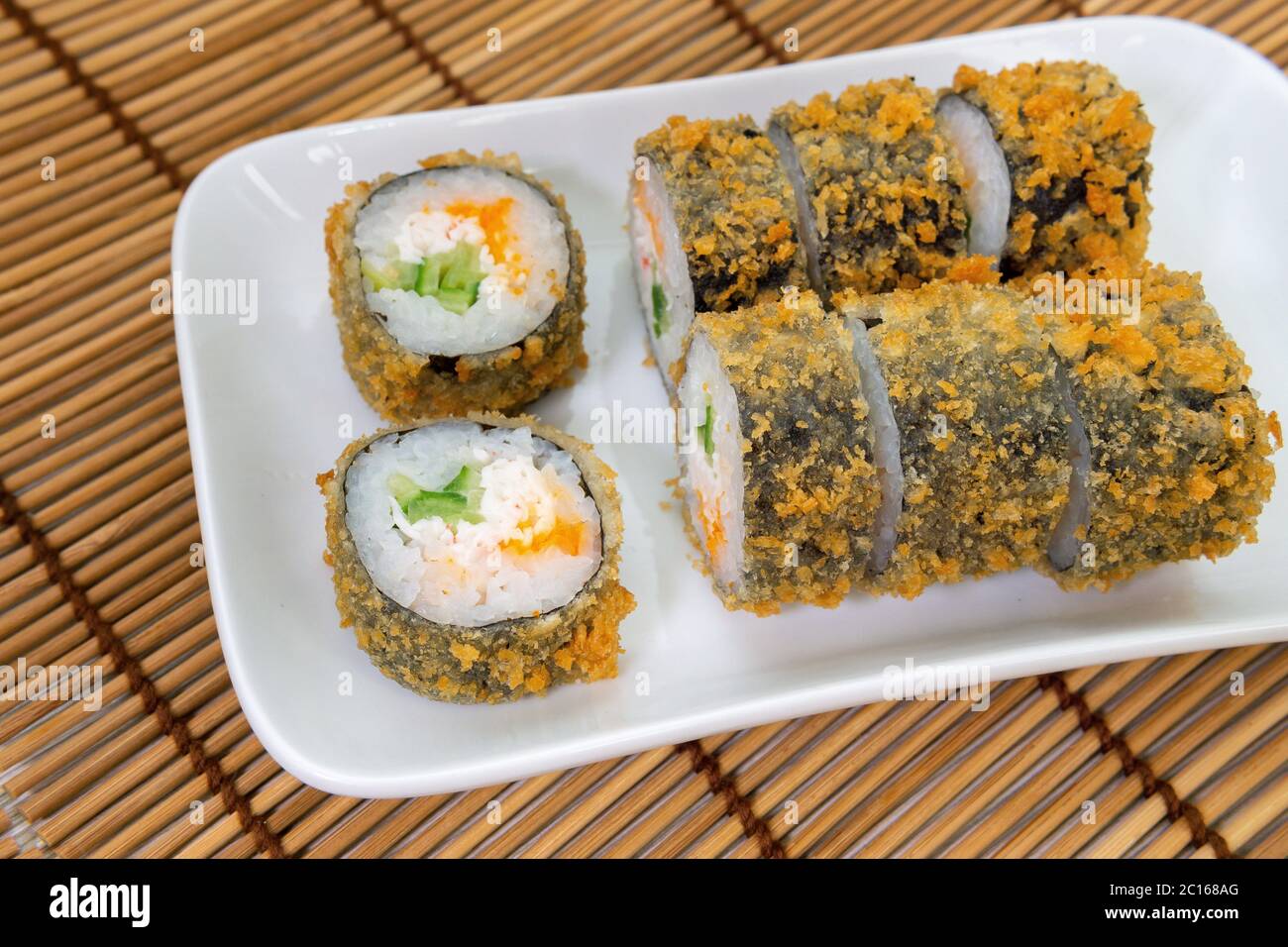 baked sushi rolls close-up. Unagi and flying fish ROE, futomaki ASI. Dish  of Japanese cuisine Stock Photo - Alamy