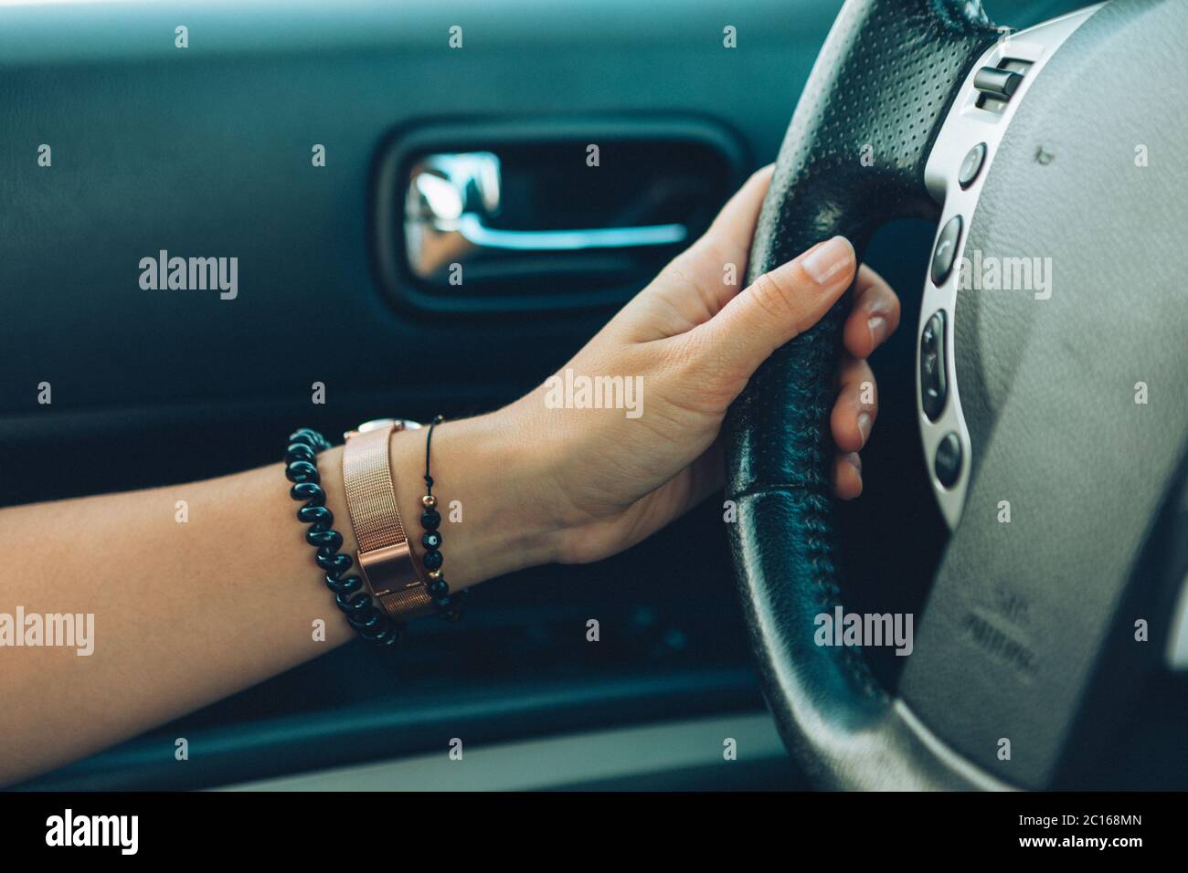Woman hands on steering wheel hi-res stock photography and images - Alamy