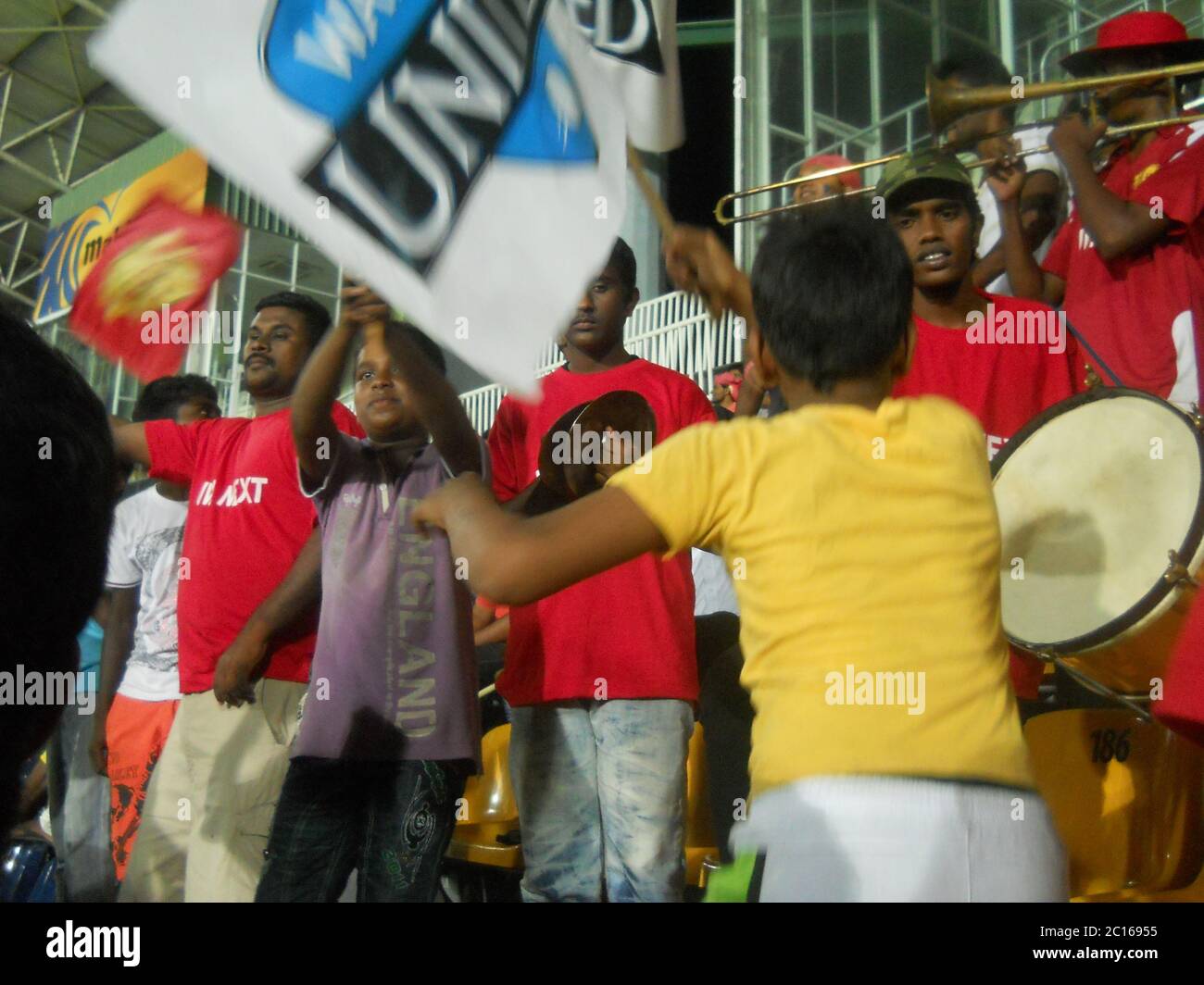 Fans enjoying and supporting their team UVA Next, during the 1st Sri Lanka Premier League (SLPL) in 2012. UVA Next were the champions of the League. R Stock Photo