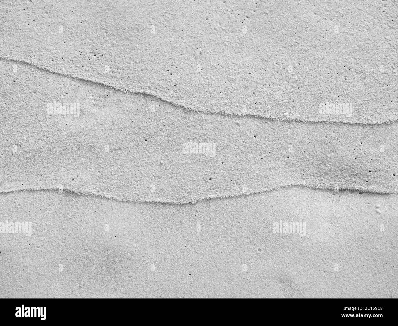 close up sand ground floor at the sea beach , background and textured, black and white color Stock Photo