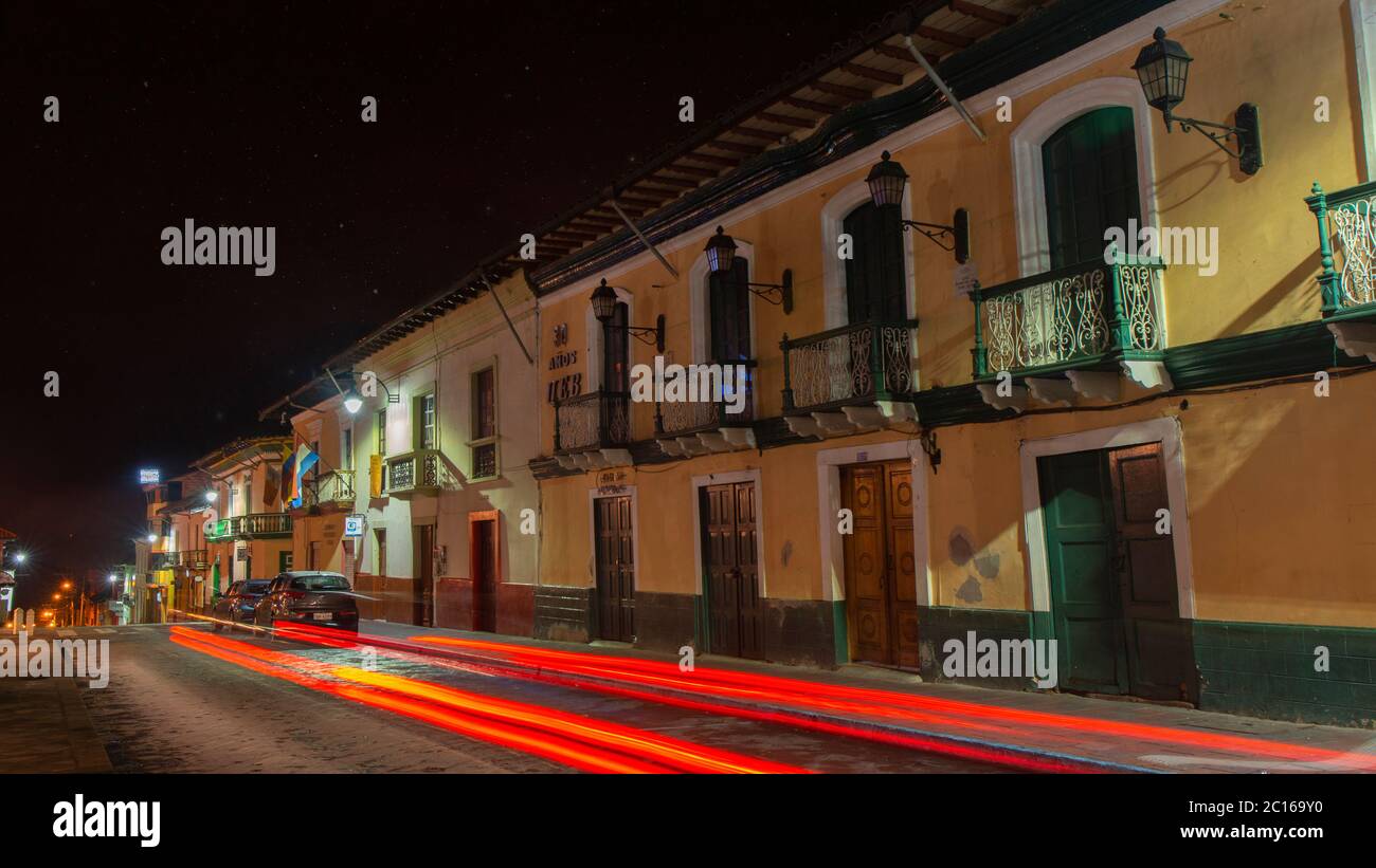 Guaranda, Bolivar / Ecuador - October 18 2019: Cars driving along an illuminated street in the center of the city of Guaranda in the night Stock Photo