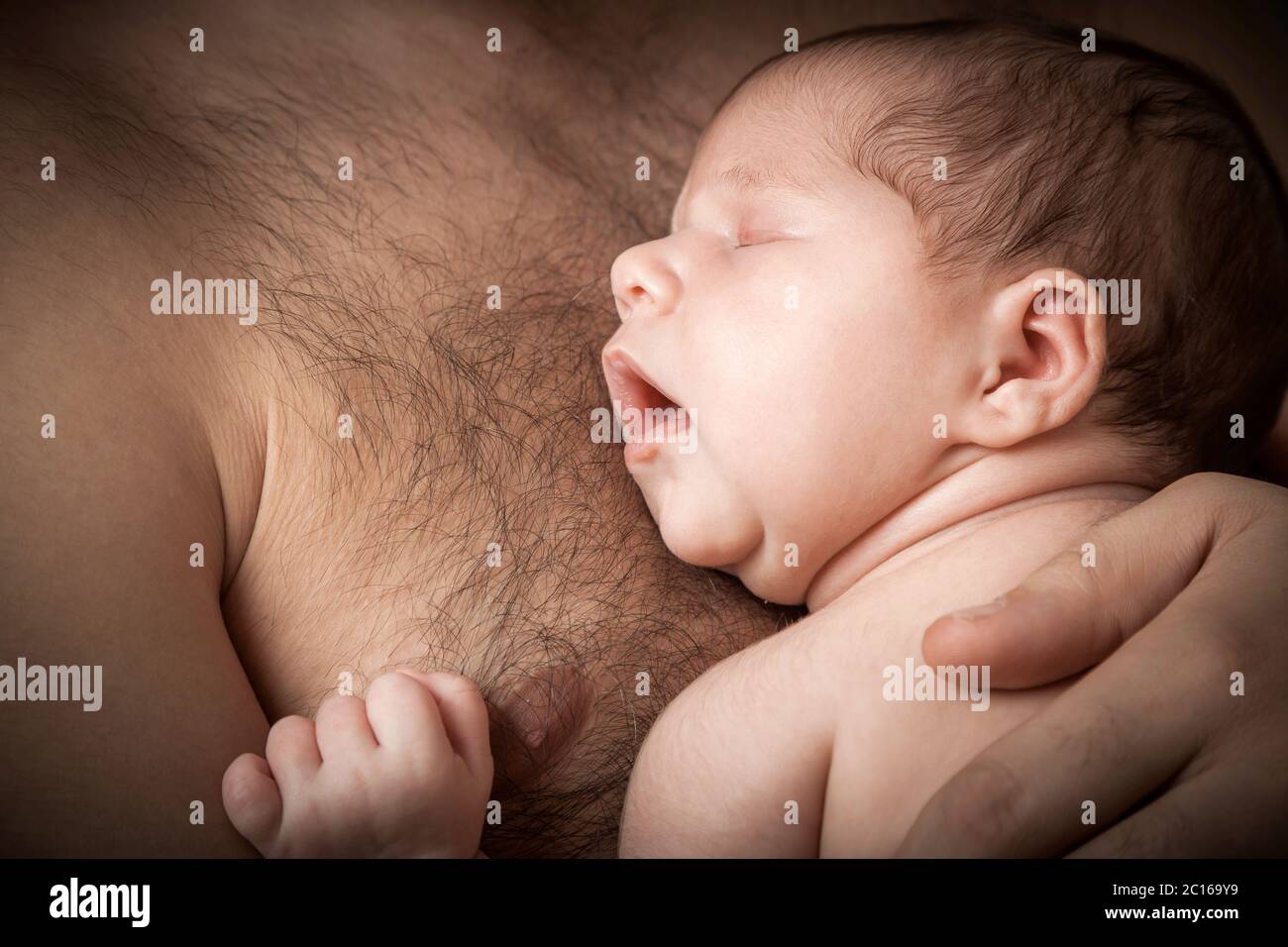 newborn child and father Stock Photo