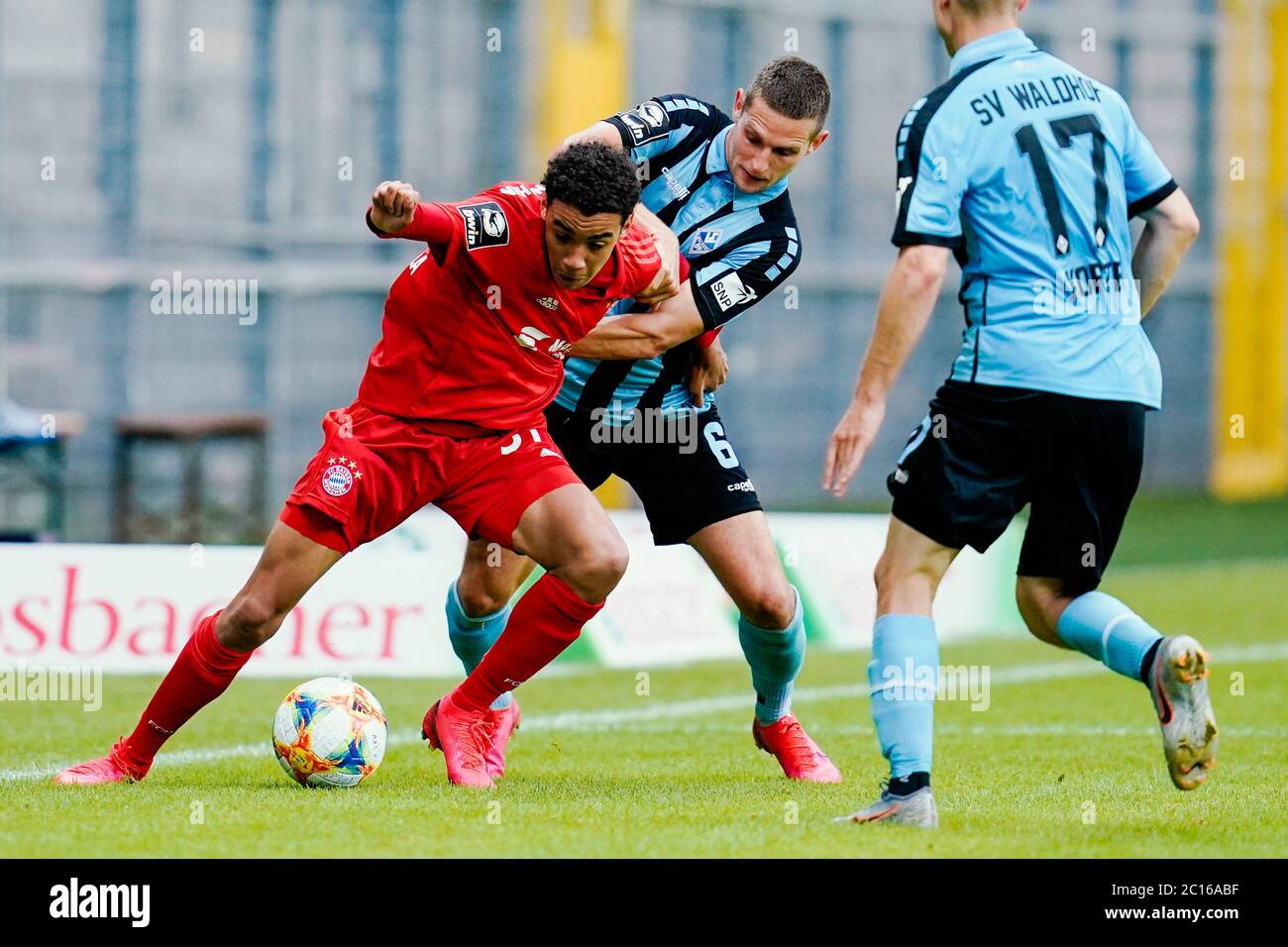 Mannheim, Germany. 14th June, 2020. Football: 3rd division, SV Waldhof  Mannheim - Bayern Munich II, 32nd matchday, at the Carl-Benz stadium.  Munich's Jamal Musiala (l) and Mannheim's Marco Schuster fight for the