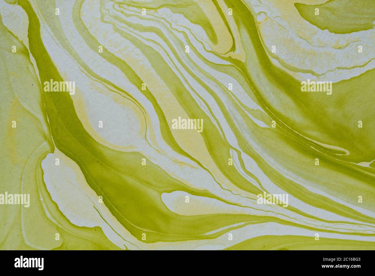 DIY monochrome marble effect abstract background with free flowing waves of green paint or pigment on white in full frame Stock Photo