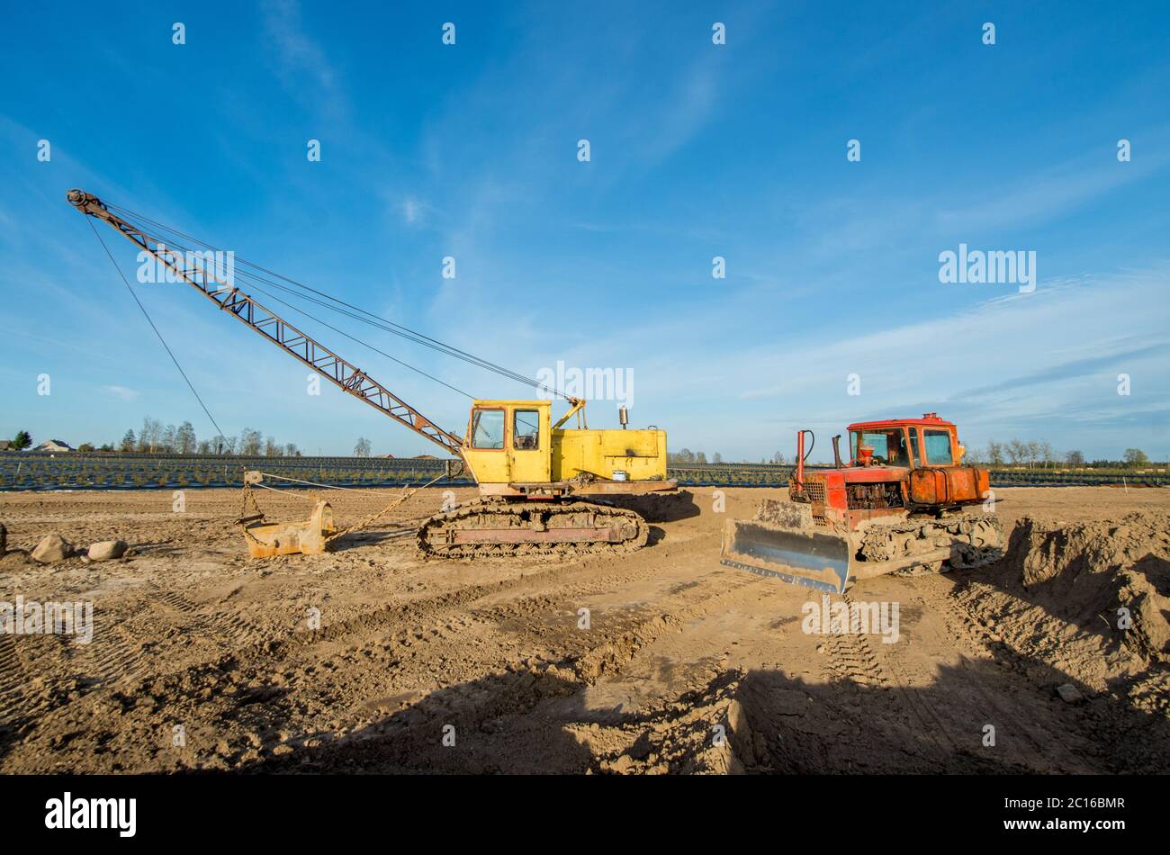 Tractor and excavator Stock Photo Alamy
