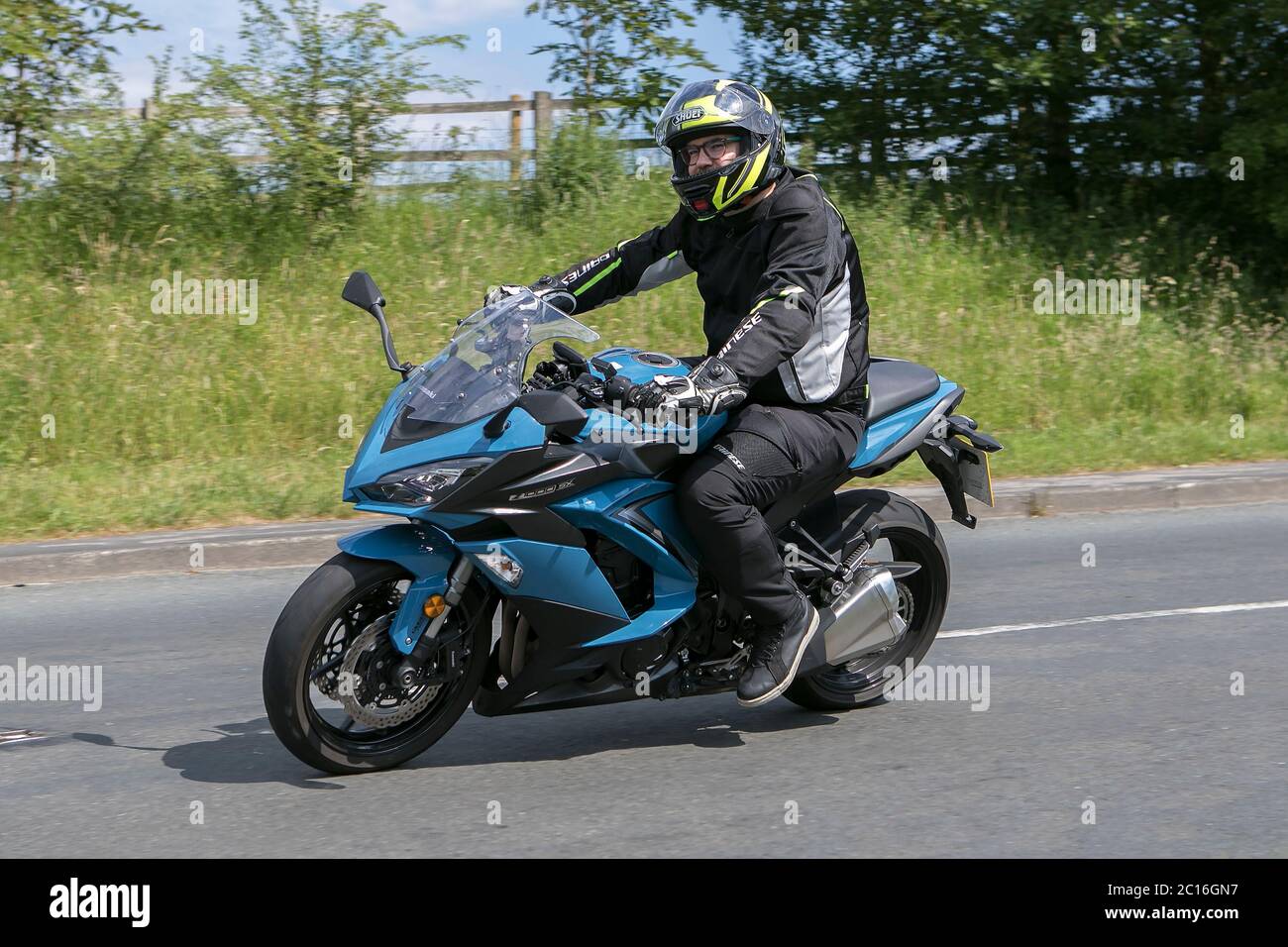 A motorbike rider driving a 2019 blue Kawasaki ZX 1000 WKF near Chorley in Lancashire, UK Stock Photo