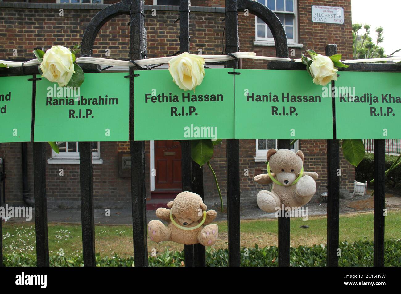 Green cards with names of victims pegged on the fence of Brabley House on Silchester Road W19 during the 3rd anniversary.Seventy-two people were killed in the blaze that burnt the 24 story tower in Kensington, west London, on 14 June 2017. The Grenfell site is to be converted into a memorial site once deconstruction is completed by 2022. Stock Photo