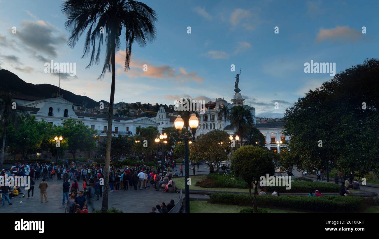 Quito, Pichincha / Ecuador - June 22 2019: People walking in the Independence Square in the historic center of the city of Quito at sunset. The histor Stock Photo