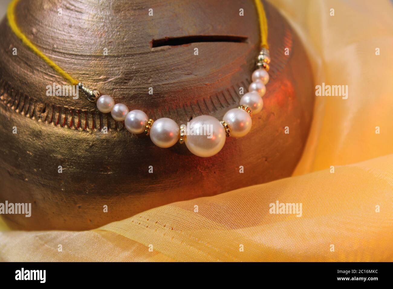 indian festivals raksha bandhan,raksha bandhan, rakhi ,Indian festival Raksha Bandhan with rakhi bracelets, presents, rice and kumkum in bowls.indian Stock Photo