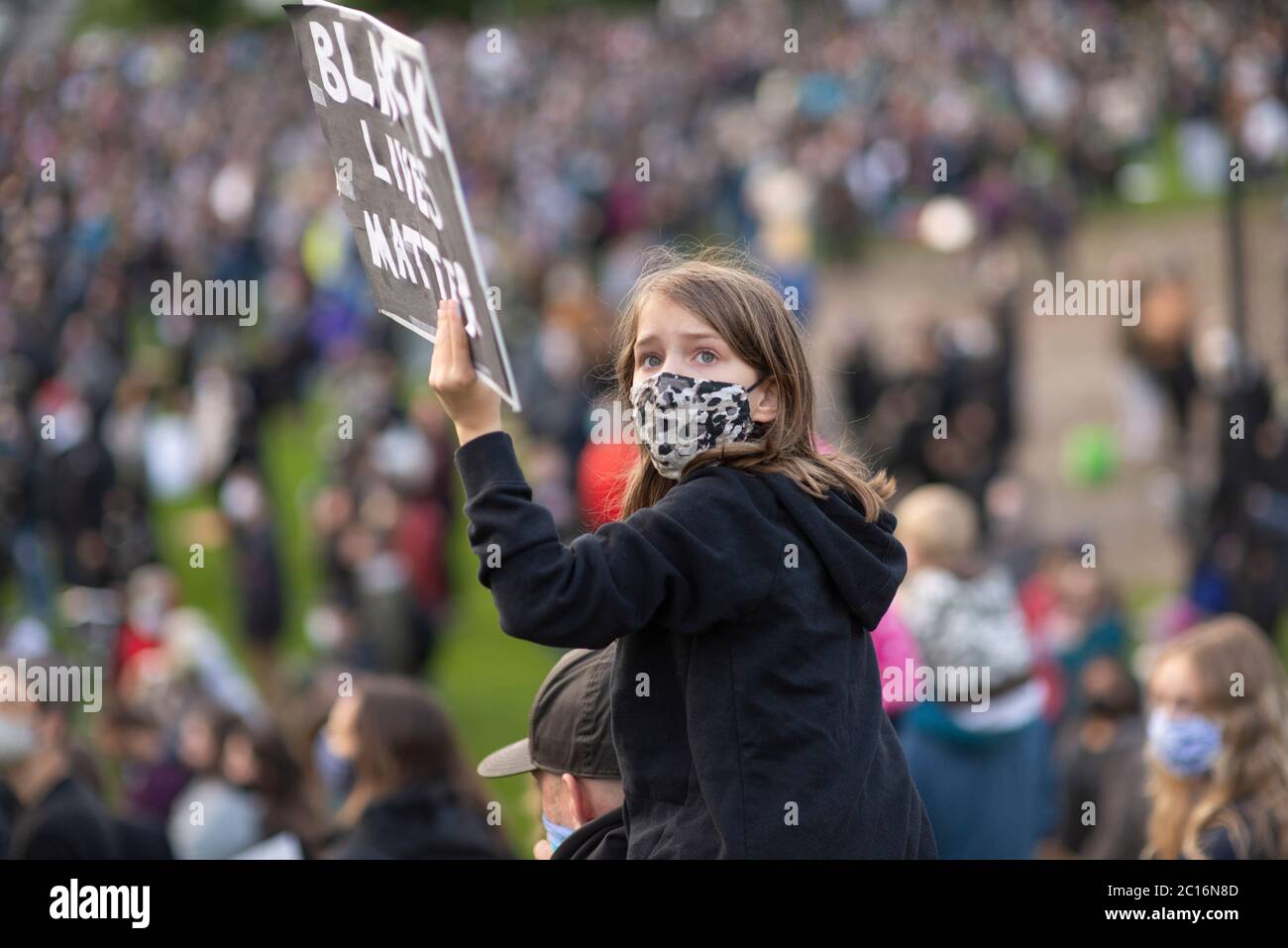 Young girls with black Lives Matter sign Stock Photo