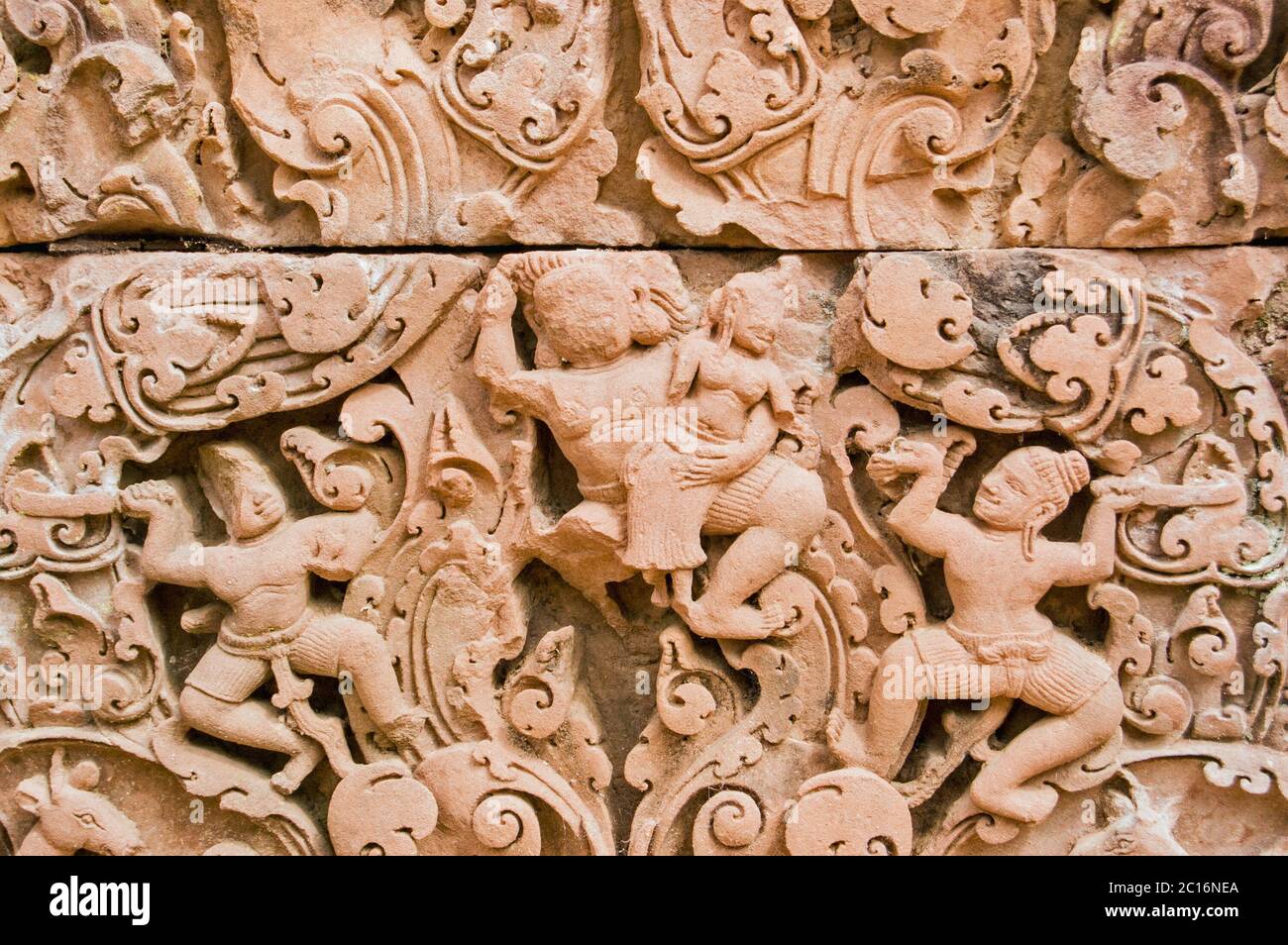 Ancient Khmer bas relief carving showing Sita being abducted by Ravan. Ram and Laxman look on helpless. Part of the Ramayana Hindu legend. Banteay Sre Stock Photo