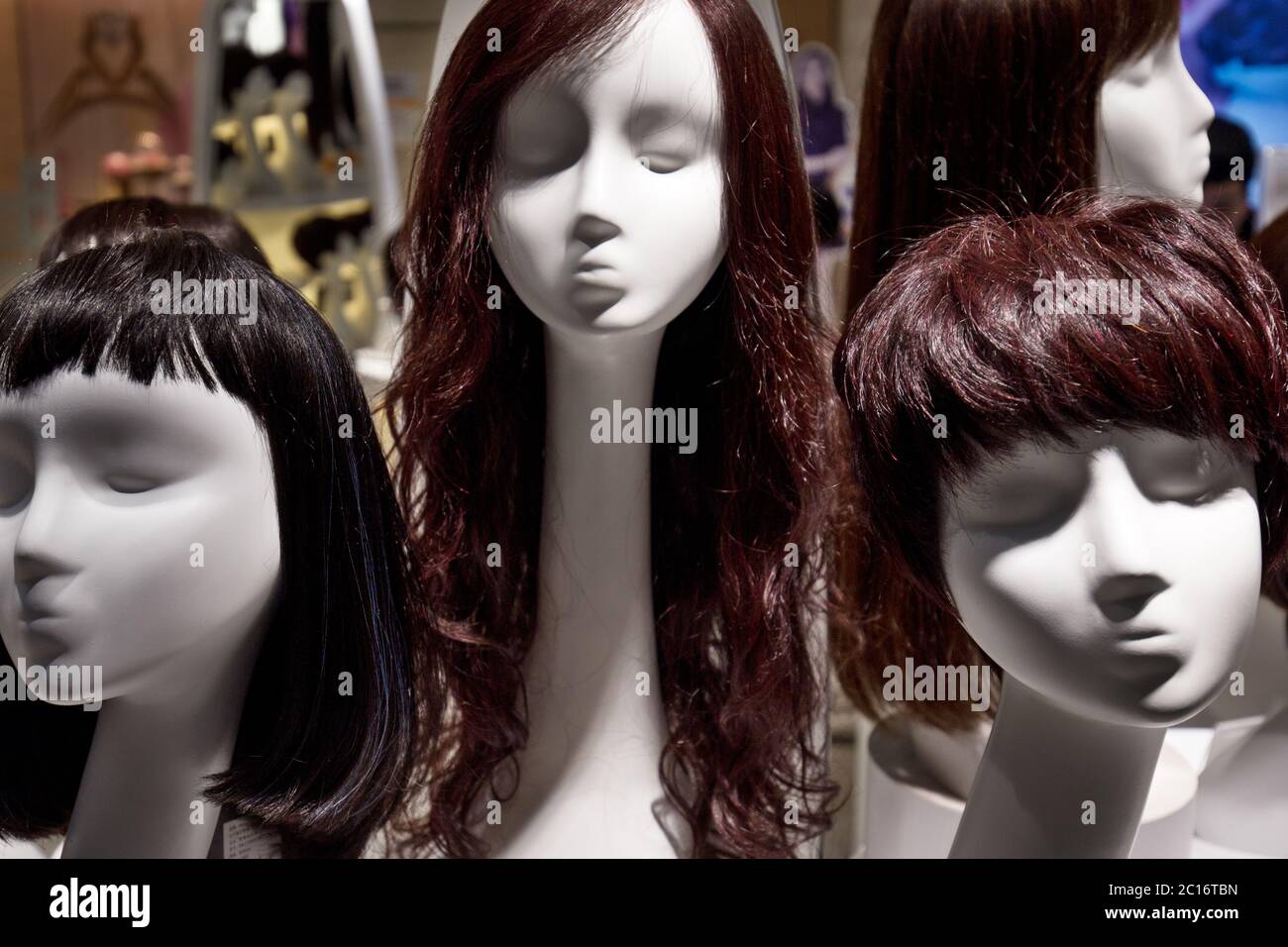 brown fake hair on mannequin Stock Photo Alamy