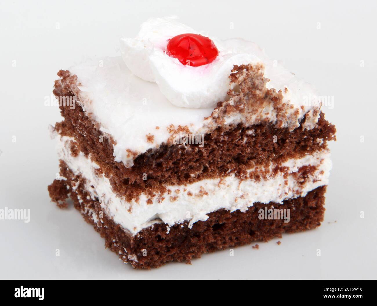 Piece of chocolate cake isolated on white Stock Photo - Alamy