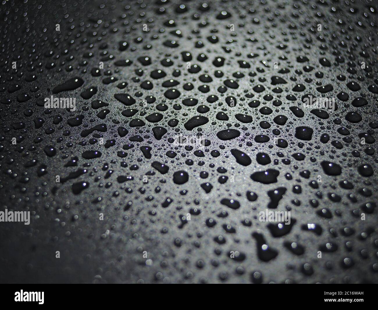 water drops on black background abstract Stock Photo - Alamy