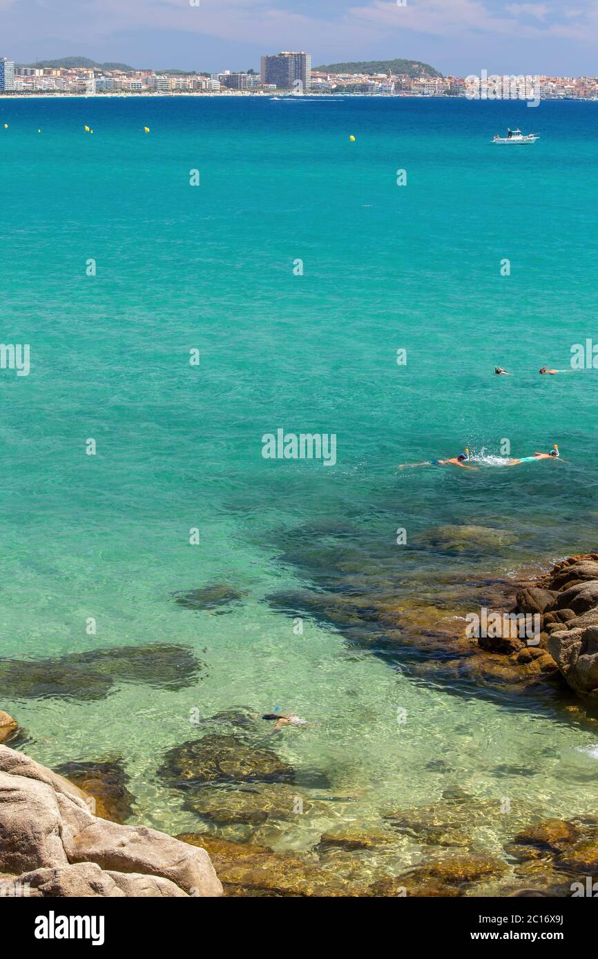 Beautiful coastal in Costa Brava of Spain with driver in transparent green water, near village Sant Antoni de Claonge Stock Photo